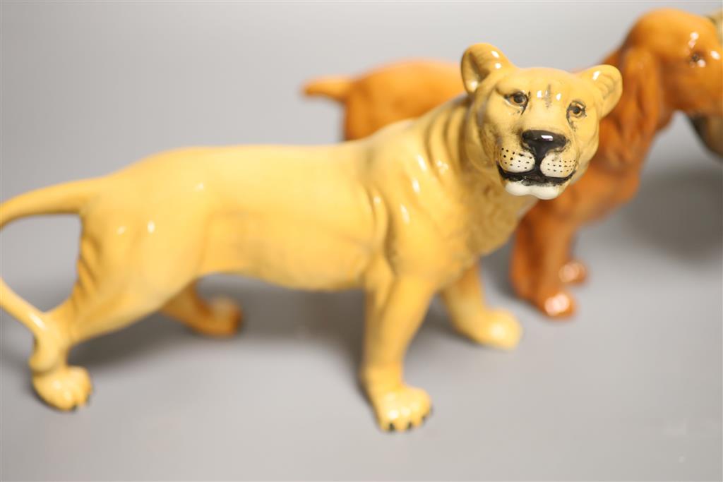 Two Beswick dogs, a lion and a lioness